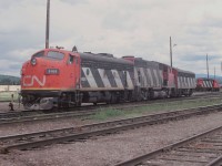 Long ago scene at Prince George yard. Not sure if these units were waiting to couple on to a train and head west or if the crew had just arrived from the east and waiting to get to the shops. It was an interesting power combination.