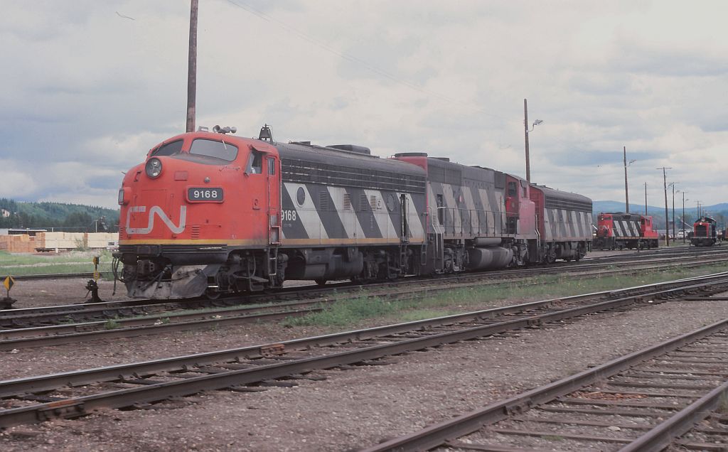 Long ago scene at Prince George yard. Not sure if these units were waiting to couple on to a train and head west or if the crew had just arrived from the east and waiting to get to the shops. It was an interesting power combination.