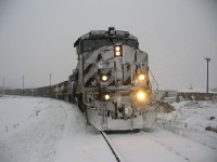 It was a bleak snowy afternoon as we prepared to switch Dunkley Lumber sawmill. Had a few moments for an image or two while the Conductor was out walking our pickup.