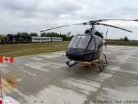Two modes of transportation meet in Snelgrove Ontario - but they are much much more closely linked than you think :) The helicopter is owned by Four Seasons Aviation Ltd. (http://www.fourseasonsaviation.com) and this facility seems to be fairly new. They are a charter airline (transportation, film, photography, etc) when I was on-site they had two pieces of equipment - this small helicopter and a much larger one inside their hangar. Give them a call if you have any aviation needs in the GTA :)<br><br>
How are these two modes of transportation linked? Well think of it this way, those of us who are into Trains are also into other modes of transportation, and in some cases professionally. OBRY Engineer (and rp.ca contributor)  <a href=http://railpictures.ca/author/runeight target=_blank>Steve Bradley</a> is at the helm piloting CCGX 4015 north with about 150 passengers aboard, and he along with his Conductor Tyler would safely pilot their train through the beautiful scenery of the Credit Valley. Steve is a retired Air Canada pilot, having worked for them for 37 years and took up 'piloting' on the ground  with CP and later with Cando. We also have a <a href=http://www.railpictures.ca/?attachment_id=17012 target=_blank>few other flyboys</a> on this site who contribute regularly. Regardless of what chair you sit in, or wether you are in the air or on the ground thank you to our 'pilots' for safely taking care of our transportation needs, your service is duly appreciated.<br><br>
Photo notes: 1/100 chance to get the Canada flag sticking out like that. Mother nature was ANGRY and the wind gusts  were 80-100km/hour at that point. I will get a lottery ticket ASAP.
