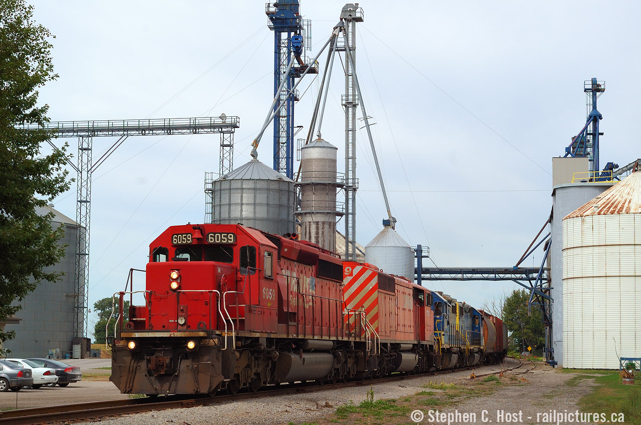 And one of my oldies - knowing this operation was on borrowed time, I convinced my Fiancee to go to Sarnia a couple days early as I wanted to shoot D724 to Blenheim with CSX geeps. Tuesday/Thursday was when D724 was ordered out of Chatham and D725 would bring some four axle power down in the morning for an afternoon run to Blenheim so what you see here is a typical Tuesday/Thursday four axle consist. I should also re-iterate this line was horribly slow, when was the last time you followed a 90 car train, 50 miles at 15 MPH? It took four hours and change, not including time building their train at Sarnia. Ordered 0600, arrived Chatham 1300. Tupperville is a neat little town, very small, one railroad customer, and has had no rail service since 2013. Rails are intact and Chatham-Kent is still looking for an operator. One day they might realise they aren't going to find someone willing to do it 'for free' and actually have to fork some money to retain rail service. But I fear it's already too late. We'll see what happens.. the final chapter hasn't been written yet.