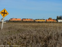 Blast off! Just west of New Hamburg, GEXR 582 is nearly finished crossing over the Highway 7 overpass, at the time restricted to 10 MPH... track speed from here to Stratford is 55? 60? MPH. Can you imagine the sound of these four axle beauties getting up to speed? Try catching up to them - good luck, it's almost impossible unless you don't mind going all the way to Stratford or beyond. My next stop after this was St. Marys if this gives you any indication to just how fast a good GEXR hogger can peg 'er at. The line west of Stratford is considerably slower.

