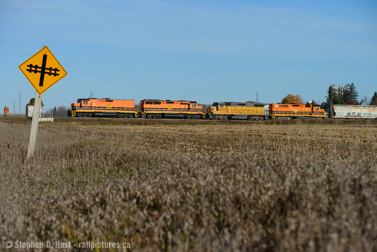 Blast off! Just west of New Hamburg, GEXR 582 is nearly finished crossing over the Highway 7 overpass, at the time restricted to 10 MPH... track speed from here to Stratford is 55? 60? MPH. Can you imagine the sound of these four axle beauties getting up to speed? Try catching up to them - good luck, it's almost impossible unless you don't mind going all the way to Stratford or beyond. My next stop after this was St. Marys if this gives you any indication to just how fast a good GEXR hogger can peg 'er at. The line west of Stratford is considerably slower.