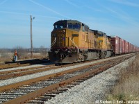 And in one of the few times I chased NS 327 to Talbotville, this chase was with Jason Noe, Jason Bartlett and Kevin Flood and we chased it to St . Thomas from Paris following all the way. Since NS 327's power tended to be a surprise, we only needed a Kodachrome sky (as some say) to proceed with the day's activities. I actually would have preferred NS power but heck, who cares, right - two UP's ain't too bad. The last run of this train was in about a weeks time thus the heavy interest. This yard and all track are now gone. <br><br>A history lesson for the young-ins, the Payne sub (formerly known as Chatham subdivision) and the Cayuga sub were once known, as a combined entity as the Canada Air Line Railway which the Wabash was granted rights from the Grand Trunk in 1897. These weren't any rights, they allowed joint and equal access to solicit customers which is VERY rare. After the Norfolk and Western and Norfolk Southern mergers, NS continued to use these rights, servicing customers in Canada until 1996 when CN desired abandoning the Cayuga sub and NS went the long way as CN had to offer a route.  (The new route was the Stamford, Grimsby, Oakville, Dundas, Talbot subs). NS had access to customers even still through Trillium Railway and CN (CN provided the last mile of service to Ford) The Payne and Chatham subs continued to be used until 2004 when the west end trains were abolished to Detroit, but this segment in St. Thomas was the western end of what remained of the Payne in service and I desired shooting NS on their original route.  Mission accomplished.<br><br>The Stamford from Draw (in the US) to Robbins (via Fort Erie) is the other section of the original Air Line route still in use by NS and continues to be used to this day by the daily NS Transfer as far as CN Duff. 