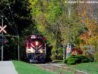 Out of the bush, suddenly a wild train appears. Basically, that's what I see when I stand along Cardigan St - a really neat little street with a sidewalk following the rail line for a block or two packed tightly with various old and new buildings. Shooting here requires a train running south around noon or the light swings to backlit. Leading the train is the other "new arrival" #182 -  but 182 was in Guelph in the first half of the 2000's and photos of it in Guelph are on this site from back then. Anyone have a precise date to when 182 was transferred to Salford? I suspect it was done to co-incide with the St. Thomas sub lease in '09.