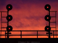 A wall of flame appears to be greeting any westbounds at Sarnia that dare pass these red signals. Of course, there were no trains, and the sky was in fact indicating a Sailors delight for Thanksgiving Monday. So with that in mind, I spent Monday along the river photographing a CN local and a few Ships that passed by. To see the ship photos visit <a href=http://www.bigships.net>www.bigships.net</a> where I will post them soon. You'll see a few familiar names there too :) 


