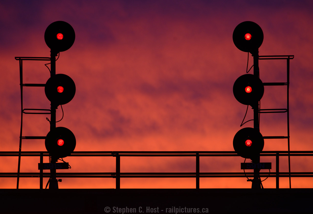A wall of flame appears to be greeting any westbounds at Sarnia that dare pass these red signals. Of course, there were no trains, and the sky was in fact indicating a Sailors delight for Thanksgiving Monday. So with that in mind, I spent Monday along the river photographing a CN local and a few Ships that passed by. To see the ship photos visit www.bigships.net where I will post them soon. You'll see a few familiar names there too :)