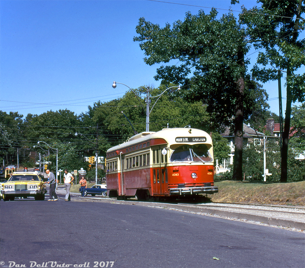 On a great sunny Sunday Summer's day to visit the nearby High Park, TTC PCC 4383 arrives at High Park Loop at the end of its Carlton run from Main Subway Station, passing one of the old yellow-painted Toronto Police cars parked nearby. A Peter Witt streetcar ("Tour Tram" 2766 signed up for Carlton, possibly in charter use) is visible heading to the loop in the background, on Howard Park near Parkside Drive.

Robert McMann photo, Dan Dell'Unto collection.