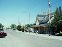 Here's an interesting view of the old CN Tillsonburg N station on Bridge St W in town. Next to it is the CP station, relocated there a few years ago. Compare this shot to <a href=http://www.railpictures.ca/?attachment_id=29148 target=_blank> #29148, </a> taken 39 years earlier. Quite the Time Machine change !!!!