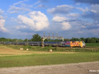 VIA 81 cuts through the rolling landscape and iconic signal bridge of Paris West as locomotive 904 proudly displays is Canada 150 colours.