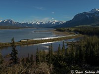 In one of the most spectacular settings in the Rocky Mountains, VIA Rail's eastbound Train #2 passes Brule Lake near Swan Landing Alberta