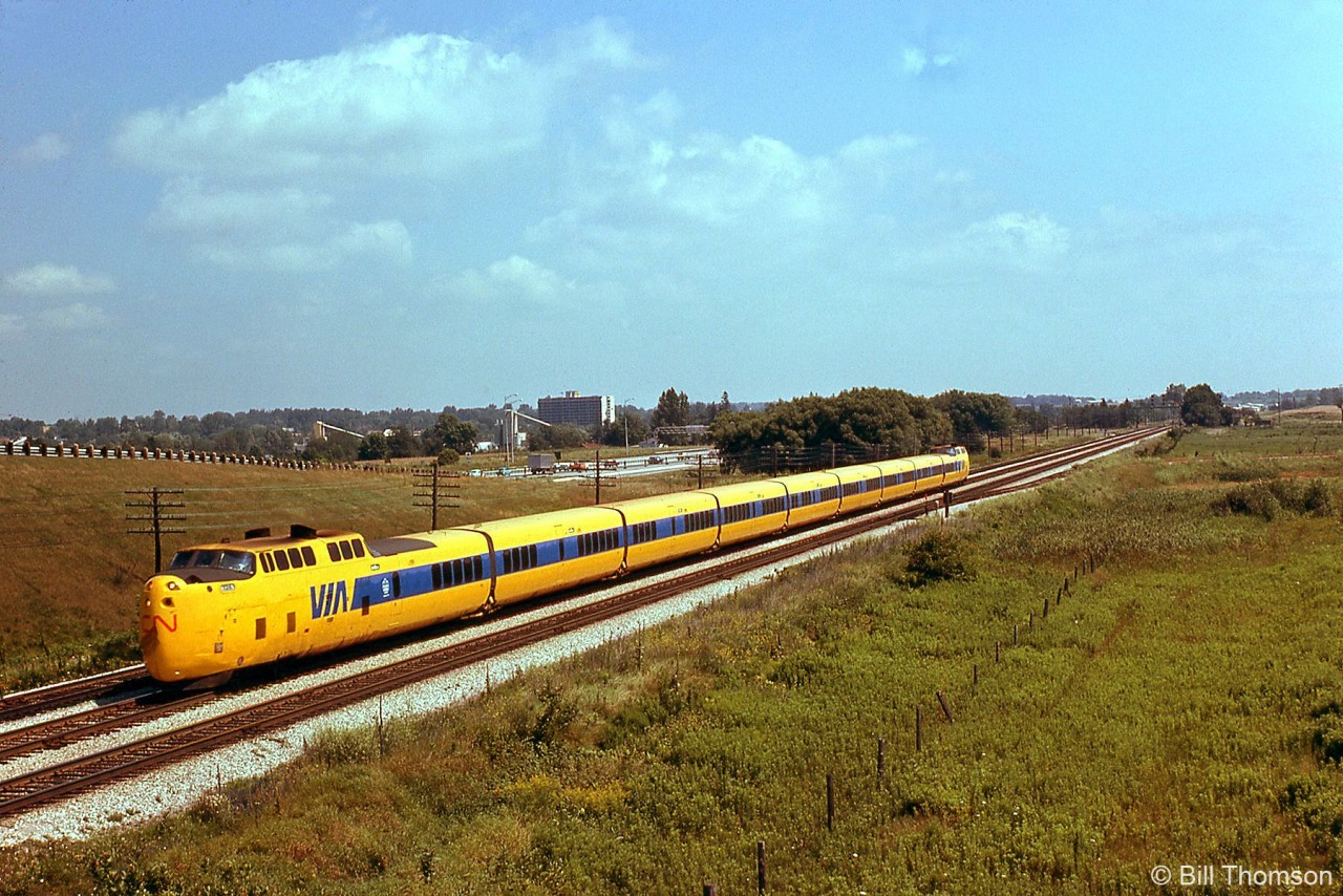 More Turbo action: VIA train #61 with its yellow and blue Turbo Train consist heads west at Pickering, along the Kingston Sub parallel to Highway 401, in August of 1976.

By 1978 it was felt that the Turbo was not the solution - the next phase was the LRC, which lasted a lot longer in VIA service.