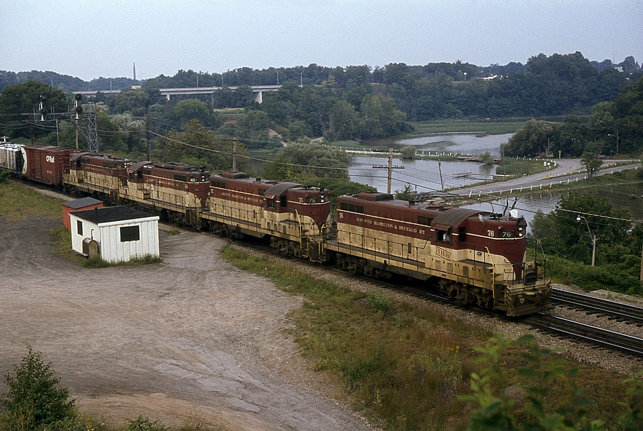 It might have been one miserable dull late afternoon, but the sighting of a 4 unit TH&B Starlite certainly brightened the day up for me. Due to work, I was not getting out to the Junction as often as I would have liked.
This capture of TH&B 76, 75, 401 and 72 has been a favourite of mine. And no one else was around at Bayview to enjoy it. Sad that it has been 30 years since we witnessed TH&B painted locomotives making the rounds.