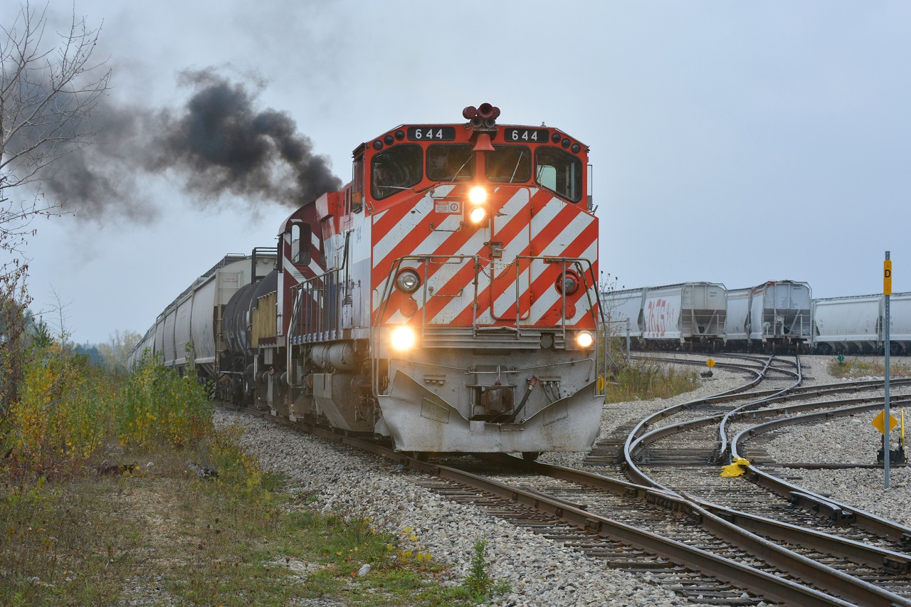 Recently acquired OSRX 644 and 505 smoke it up as they pull hoppers out of PDI Massey. They will head back across the Hanlon to switch on the North Guelph Spur after lifting cars from beside Gerdau Metals