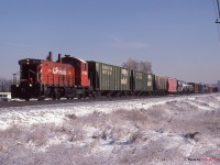  The previous nights freezing rain has given way to blue skies as the CP "Obico" switcher lead by lone SW1200RS 8139 runs across the Belleville Sub between Agincourt and Leaside at Don Mills  