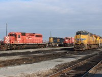 UP power awaiting it's departure along with CSX 4541 in the background sits among stored CP SD40-2's.