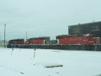 A trio of SD40-2's head towards the shop to pull out an engine ready for service. At the time of the photo the 5879 and 6018 were out of service and stored while the 6067 was the only one running and was about to be tied up in storage within days.