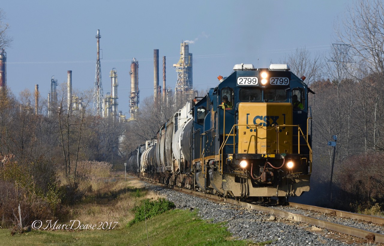 In the shadow of the Suncor Refinery, CSX 2799 with CSX 2570 head for the CN Yard with a cut of 31 cars.