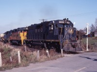 The TH&B's inaugural Steel train climbing up the grade and horseshoe curve at Summit, a stones throw from the CNR Dundas subdivision. If you were sitting at CNR Copetown and heard EMD's grinding up grade but didn't see them, it was the other hill - the TH&B that was providing the show. I'm sure this was nothing short of amazing. Note this is now the Hamilton-Brantford rail trail, and the farm is still there.