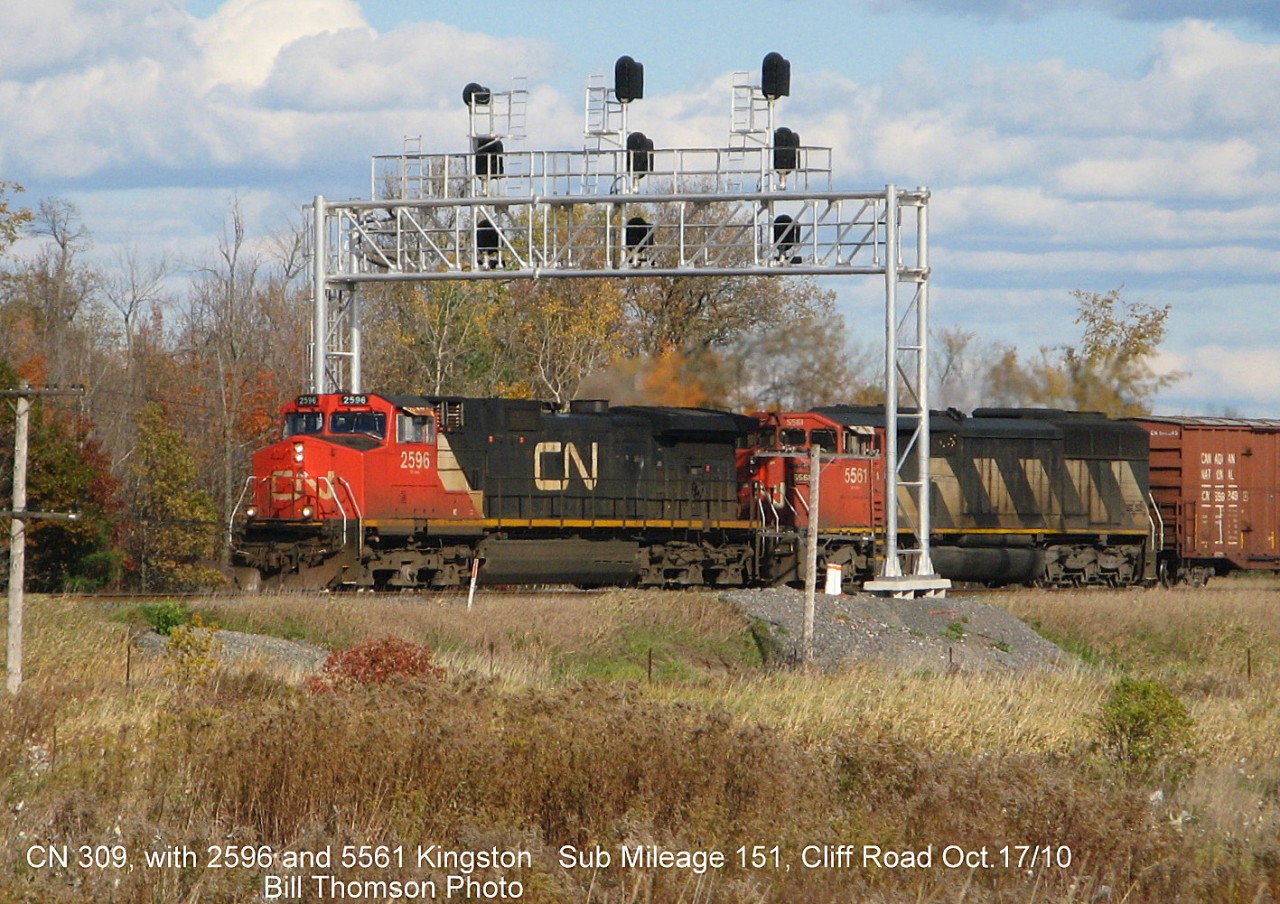 CN train 309 with C44-9W 2596 and SD60F 5561 are pictured at Mile 151 of the Kingston Sub at Cliff Road (near CN Leeds), on October 17th 2010.