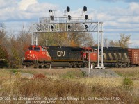 CN train 309 with C44-9W 2596 and SD60F 5561 are pictured at Mile 151 of the Kingston Sub at Cliff Road (near CN Leeds), on October 17th 2010.