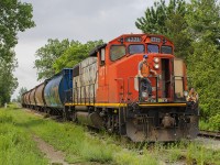CN 514 trundled down from Chatham led by an aged 4771, using the last remaining track of the former C&O Sub # 2. The crew is starting to prepare for it's drop, as well as to pickup some return cars bound for Thamesville. Here, it is seen creeping along as it enters Blenheim on former C&O Sub #1. Thankfully the sun peeked through on an otherwise cloudy and dull Canada Day. 