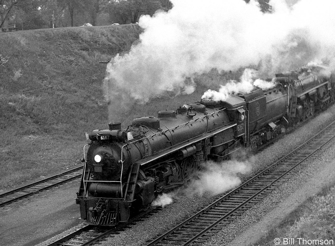 Charging up the Dundas Sub with a full head of steam, CN excursion Northerns 6167 and 6218 pass through Bayview Junction bound for Paris Jct, on a VERY rainy September 27th 1964 day.