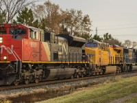 <b> ANYTHING BUT NORMAL! </b> It was a chilly one last week, and again I found myself crazy enough to be outside braving the elements before work waiting for the inevitable and usually normal CP train 141. A few days before, other photographers had already nabbed leased CN 8909 on a string of freights working hard for the power short Canadian Pacific. Even my previous attempt, from standing in the rain and photographing 8909 in the lead led to being 'just ok' photos due to poor weather and well, not double checking my camera settings! After that, disappointment left a bitter taste in the mouth along with a nasty cold. But good things do happen, and braving the gusts of wind I was ready for the second chance. This is not your everyday train!!! With the sun about to make it's brief morning appearance, CN 8909 is again in the lead followed by UP 8031 and CSX 4541 hauling CP train 141 west through Chatham.