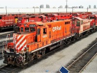 A selection of 4 axle power on the west end end of the shop includes GP9's 1684 8203 8223, GP40-2 4657, Genset 2100 and SW1200rs slug 1002. A lone SD40-2 5787 rounds it off.