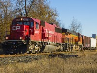 CP 6252 leads BNSF 8109 and it's train past the John C. Bradley Convention Centre in Chatham on a very cold and chilly morning. With the leaves falling through the cold crisp air, Figured it was a nice way to combine both seasons - fall and winter (note the accumulated snow on the trucks of the engines!).