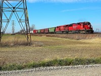 CP 6257, with helper CP 8849, is in charge of train 140 at mile 91.8 on the CP's Windsor Sub.