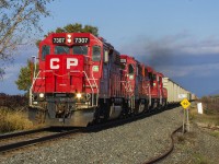 On one of the first cooler fall days, CP 7307 (ex Delaware & Hudson) leads 235 away from the stormy skies and through the countryside of Chatham-Kent, bound for Windsor.