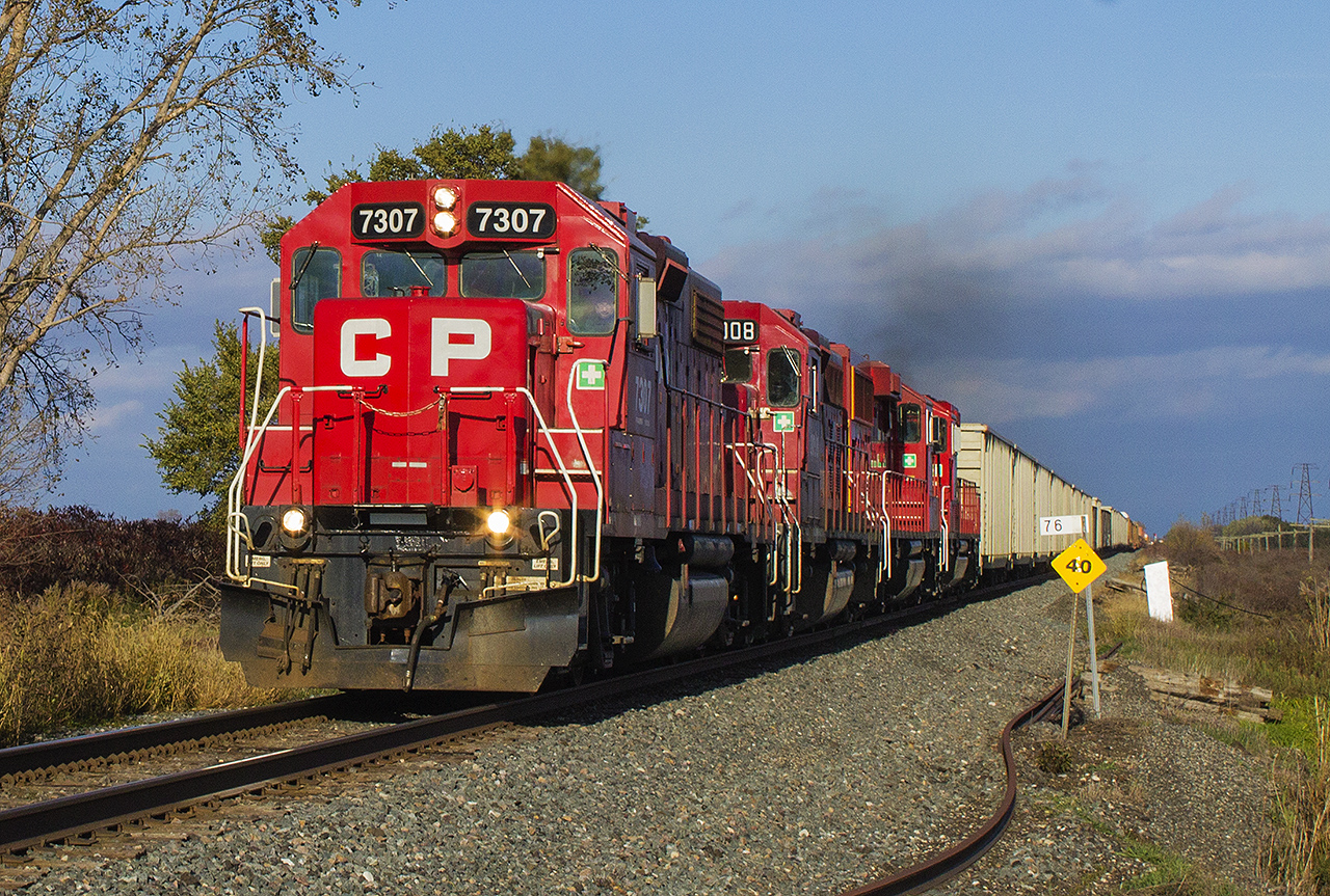On one of the first cooler fall days, CP 7307 (ex Delaware & Hudson) leads 235 away from the stormy skies and through the countryside of Chatham-Kent, bound for Windsor.