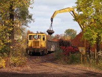 A Zalev Brothers Scrap Co. - a division of Ferrous Processing & Trading - GE 44 tonner is seen here with a handful of gondolas being loaded by a large magnet attached to an excavator. A very neat process to watch this autumn afternoon. This place has been here for ever, expanding over time into what was once part of the MC/NYC Windsor Yard, they are the last remaining customer left on CN's CASO Sub. Part of the former Windsor Yard complex is still in use today as CN's Van de Water Yard. 