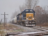 With the flurries flying, CSX 2570 & CSX 2757 head their 39 car train past Lasalle Rd. after interchanging with CN. They departed the station in the sun around 10:00, switched the yard then brought a single tank car down to Praxair before shoving three back to the yard. They then picked up their train of 59 tank cars and headed over to CN, returning here at 15:20.