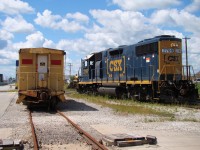 Heading south past the station to switch the yard on a hot mid-summer afternoon.