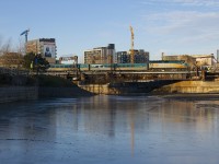 If I took this shot during the summer I'd be close to my shoulders in water, but with the Peel Basin mostly drained for the winter I was able to walk out into the basin and get this shot of VIA 6445 leading VIA 33 past Wellington Tower on a sunny but could enough morning.