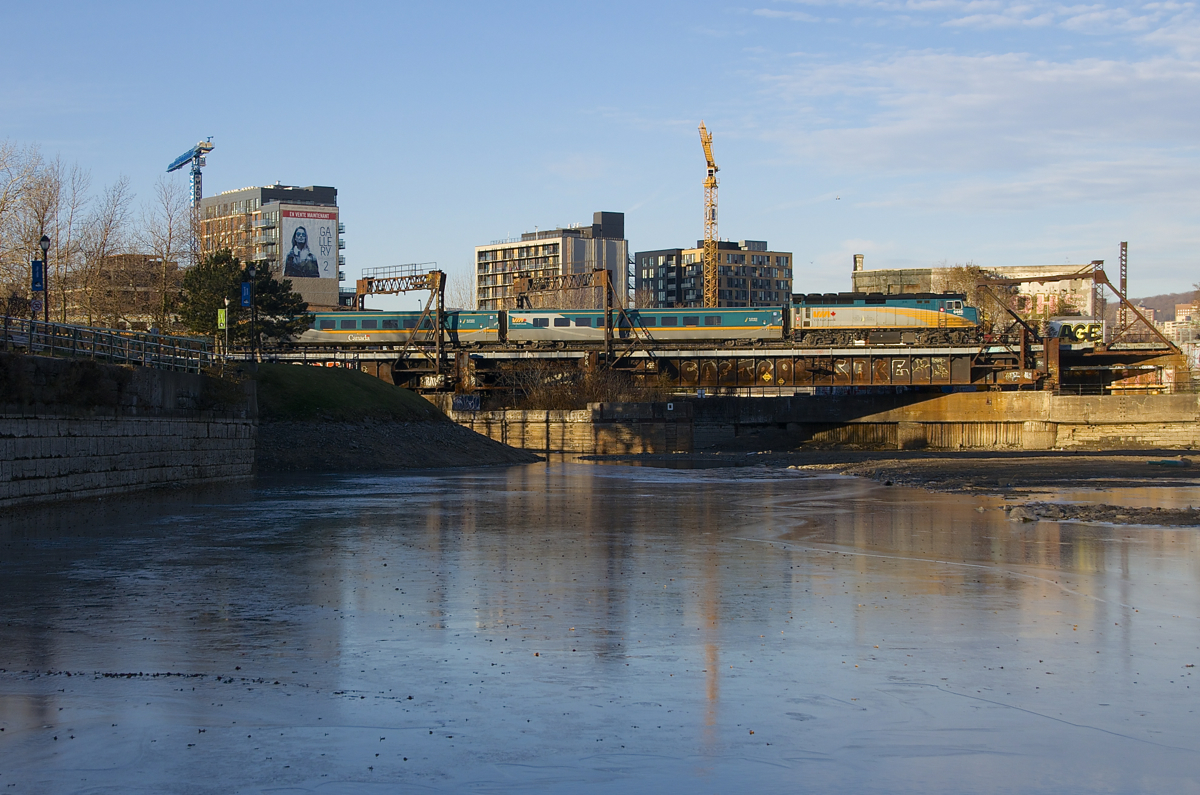 If I took this shot during the summer I'd be close to my shoulders in water, but with the Peel Basin mostly drained for the winter I was able to walk out into the basin and get this shot of VIA 6445 leading VIA 33 past Wellington Tower on a sunny but could enough morning.