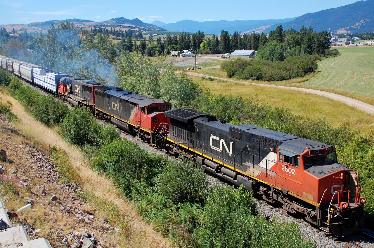 From time to time, depending on the load, the local Okanagan freight requires 3 instead of 2 units. This day was such a day and CN nos.2602,2442 & 5474 are seen approaching Armstrong with a northbound train.