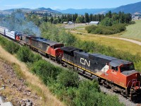 From time to time, depending on the load, the local Okanagan freight requires 3 instead of 2 units. This day was such a day and CN nos.2602,2442 & 5474 are seen approaching Armstrong with a northbound train.