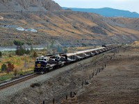 RMR nos.8012 & 8016 are rolling into Ashcroft with an eastbound train. Burned fence posts to the right of the track highlight an area that suffered during an early summer wildfire.