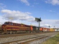 The PRR heritage unit (NS 8102) came into Montreal on run-through train CN 529 (aka CP 931/NS 31T) and was in use on Montreal-area transfer CN 527 for the third day in a row today. Here it leads CN 527 (with CN 2225 trailing) as it prepares to leave Southwark Yard with 76 cars for Taschereau Yard, foregoing its usual work at Pointe St-Charles Yard. 