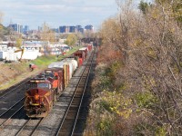 Heritage unit NS 8102 is leading CN 527, nearly into Taschereau Yard with 76 cars from Southwark Yard. 