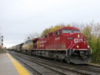 CP 651 with repainted CP 8639 and faded CSXT 7650 is through Lasalle Station on a grey morning.