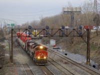 A very long CN 120 (704 axles) is exiting Taschereau Yard with CN 8010, BCOL 4612, CN 2146 & CN 2267 for power up front and no DPU (a rarity recently). It is passing ditching projects on either side of CN Montreal's Sub; this area is prone to water accumulation during the winter or spring.