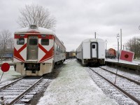 RDC-1 CP 9069 and GO Transit coach GOT 1101 at Exporail on a snowy afternoon In the distance at right is GP9 CP 1608.