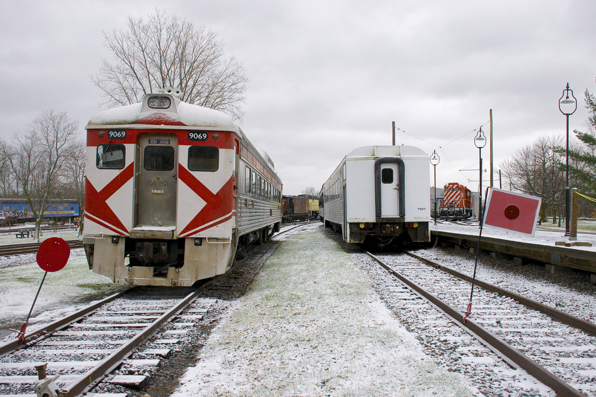 RDC-1 CP 9069 and GO Transit coach GOT 1101 at Exporail on a snowy afternoon In the distance at right is GP9 CP 1608.
