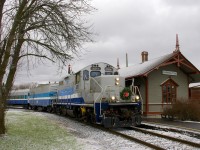 For what I believe is the the first time, Exporail ran a Christmas Train today, from Hays Station to Des Bouleaux Station (they will be running it next Sunday as well). By coincidence the Montreal area got a bit of snow today; here the train (with a rare all-AMT consist of GP9 AMT 1311, generator car AMT 603 and coach AMT 827) passes Barrington Station, where Santa Claus will be let off until the next run.