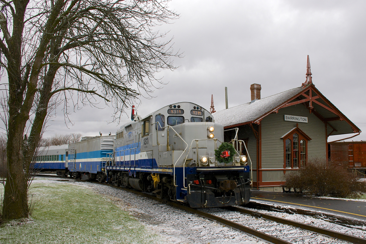 For what I believe is the the first time, Exporail ran a Christmas Train today, from Hays Station to Des Bouleaux Station (they will be running it next Sunday as well). By coincidence the Montreal area got a bit of snow today; here the train (with a rare all-AMT consist of GP9 AMT 1311, generator car AMT 603 and coach AMT 827) passes Barrington Station, where Santa Claus will be let off until the next run.