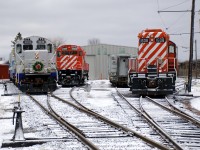 Exporail's Christmas Train (with a rare all-AMT consist of GP9 AMT 1311, generator car AMT 603 and coach AMT 827) approaches Hays Station to pick up another round of passengers. At right is M-636 CP 4563, LRC-3 VIA 6921 and GP9 CP 1608.